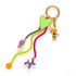 Geef je tas een eigenzinnige upgrade met deze opvallende bag charm, dé trend van dit moment waar je niet omheen kunt. Met een groot gekleurd hart, een smiley, Balloon Dog en een schattig astronautje straalt deze charm pure fun en persoonlijkheid uit.

Je klikt ‘m in een handomdraai aan je tas, rugzak of sleutelbos. Perfect om jouw look nét dat beetje extra te geven. De kleurrijke combinatie en eigenzinnige details zorgen voor een instant happiness-gevoel, elke keer als je ‘m ziet bungelen.